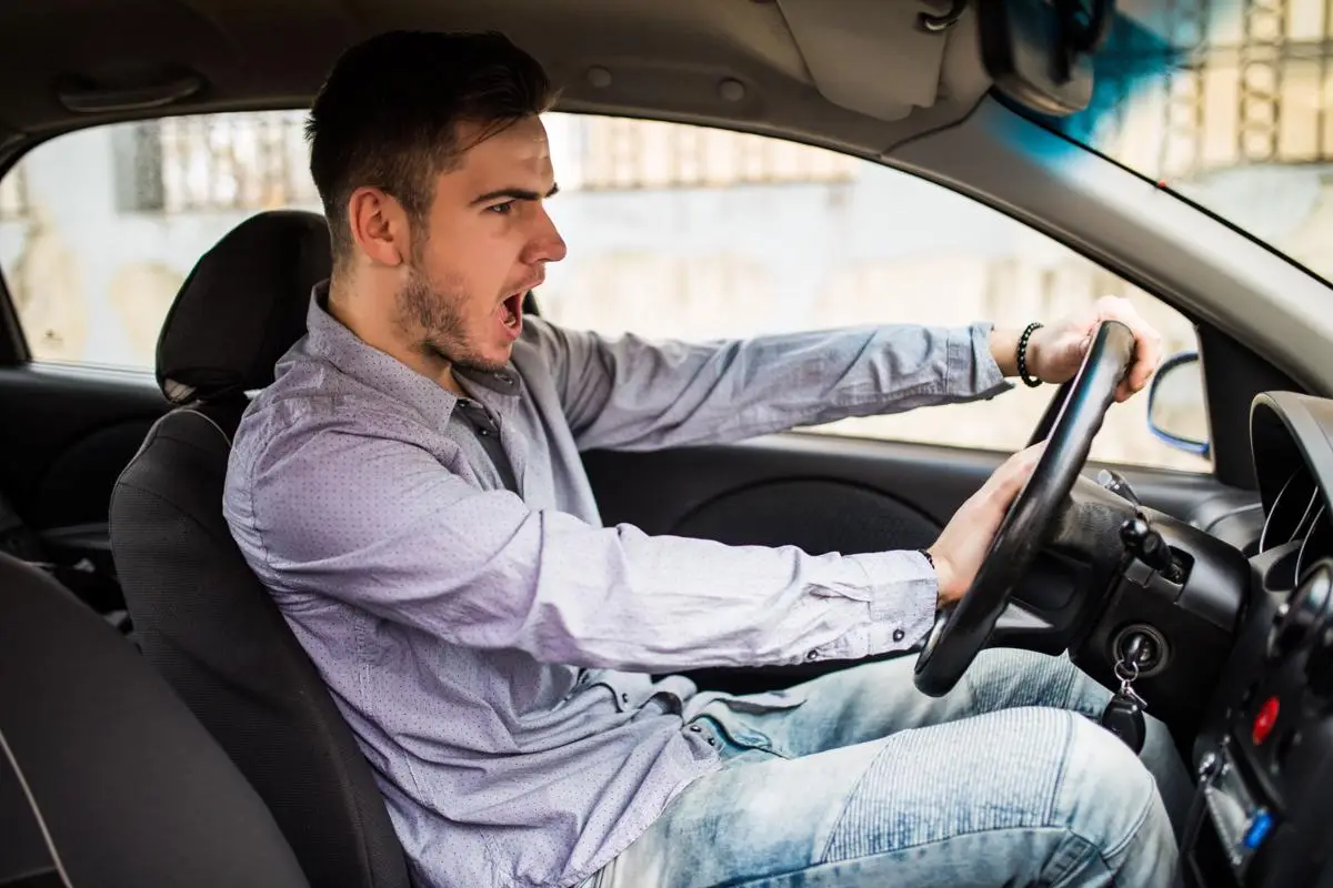 traffic-problems-nice-emotional-man-giving-signal-while-driving-car-1_dcc78a73-6ba3-4f9c-8aab-a4b2dec28ba3